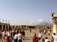 Pompeii's city center: the Temple of Jupiter is overlooked by Mt. Vesuvius in the background, the very volcano that destroyed the city.